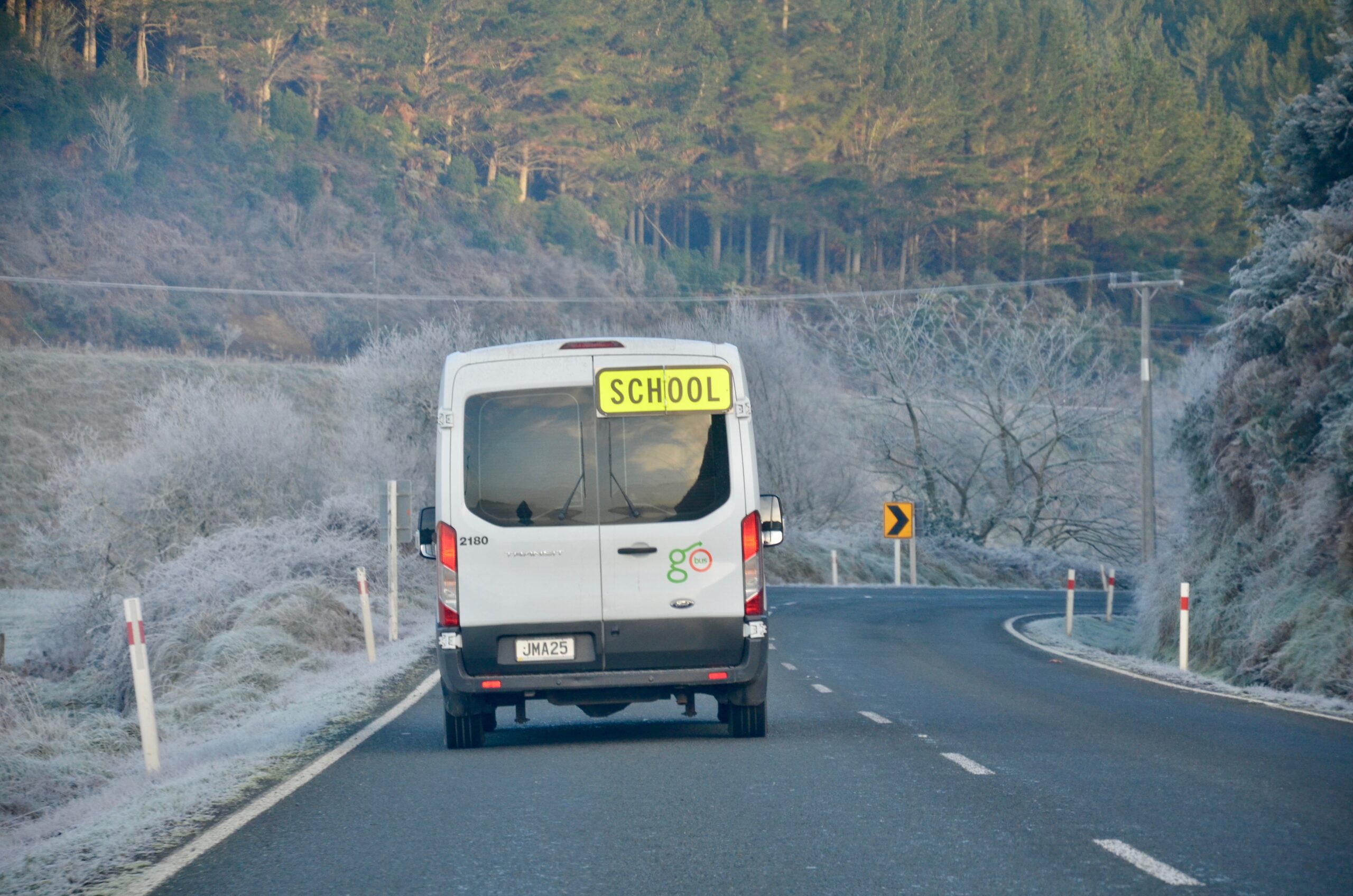 Rural school buses at a crossroads